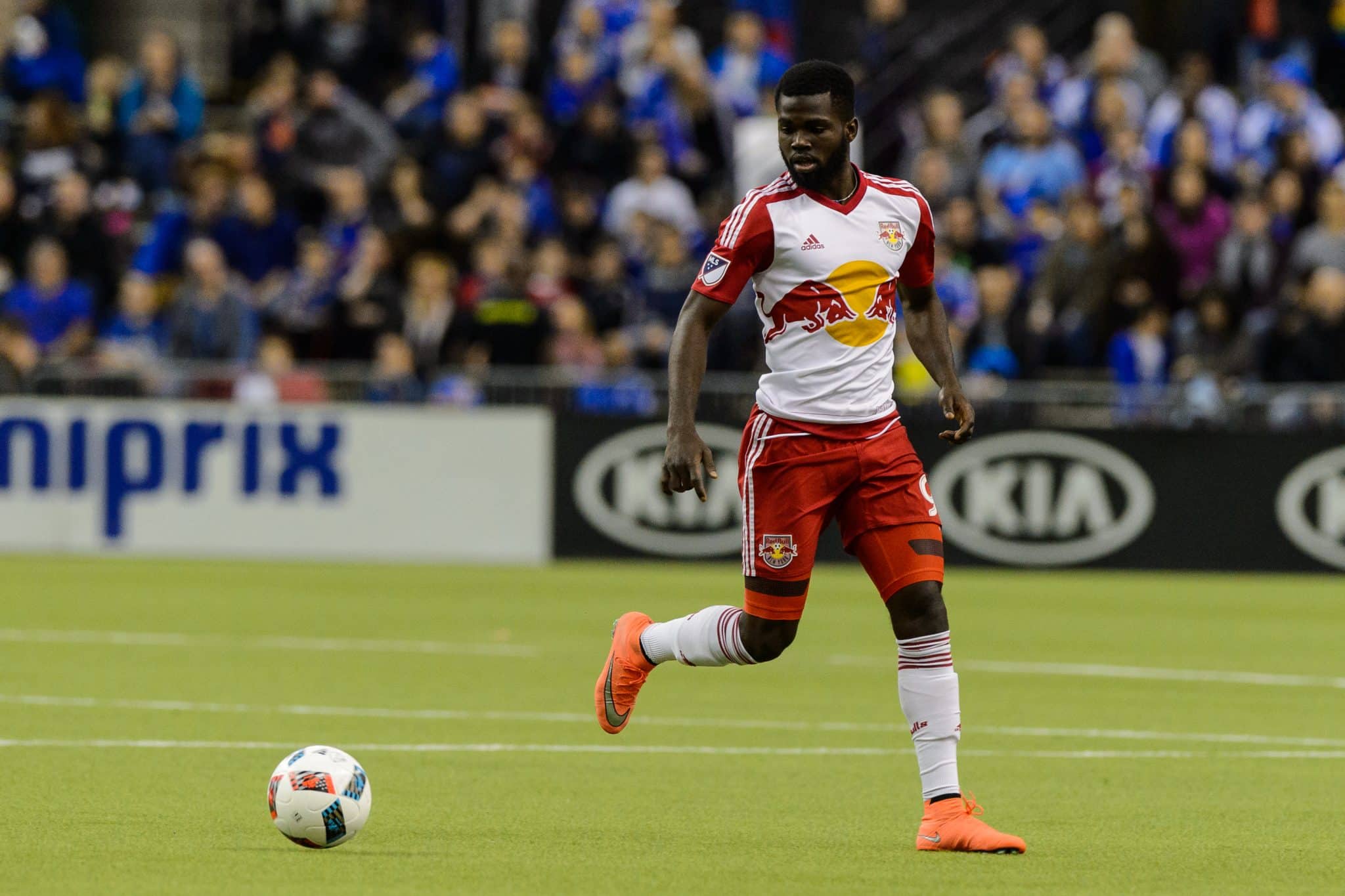 MONTREAL, QC - MARCH 12: Kemar Lawrence #92 of the New York Red Bulls runs with the ball during the MLS game against the Montreal Impact at the Olympic Stadium on March 12, 2016 in Montreal, Quebec, Canada. The Montreal Impact defeated the New York Red Bulls 3-0.