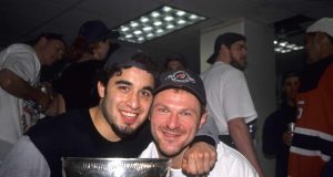 DALLAS - JUNE 10: Claude Lemieux #22 of the New Jersey Devils and Scott Gomez celebrate with the Stanley Cup Trophy after winning the 2000 Stanley Cup Finals game against the Dallas Stars at Reunion Arena on June 10, 2000 in Dallas, Texas.