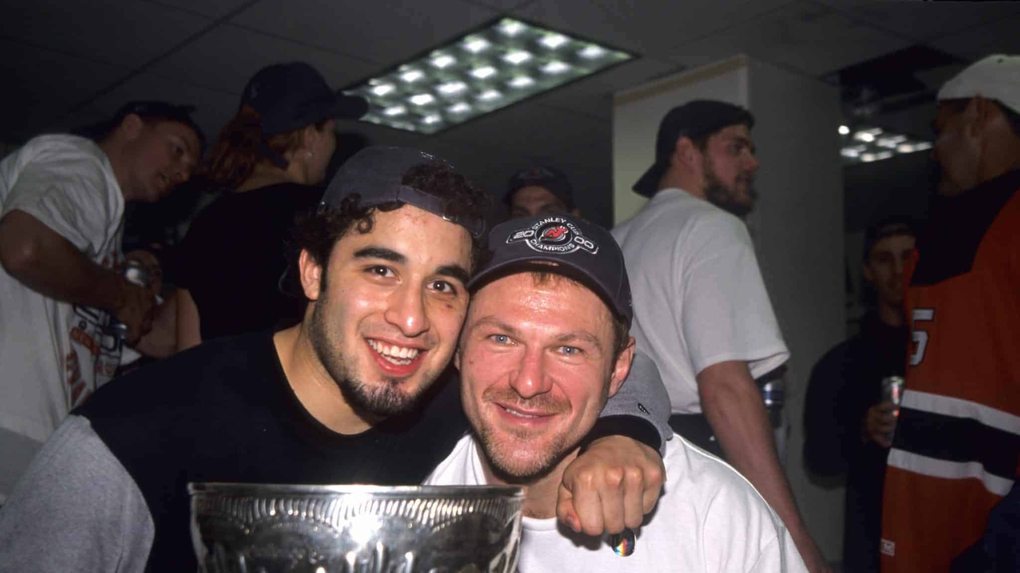 DALLAS - JUNE 10: Claude Lemieux #22 of the New Jersey Devils and Scott Gomez celebrate with the Stanley Cup Trophy after winning the 2000 Stanley Cup Finals game against the Dallas Stars at Reunion Arena on June 10, 2000 in Dallas, Texas.