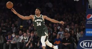 Milwaukee Bucks forward Giannis Antetokounmpo (34) passes the ball during the second half of the team's NBA basketball game against the New York Knicks in New York, Saturday, Dec. 21, 2019.