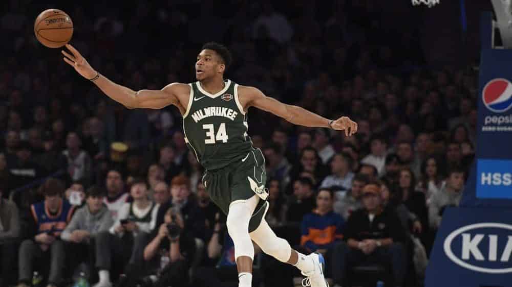 Milwaukee Bucks forward Giannis Antetokounmpo (34) passes the ball during the second half of the team's NBA basketball game against the New York Knicks in New York, Saturday, Dec. 21, 2019.