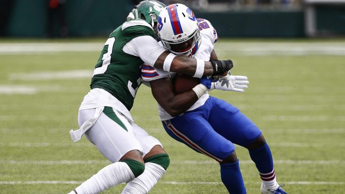 EAST RUTHERFORD, NJ - SEPTEMBER 8: Devin Singletary #26 of the Buffalo Bills is wrapped up by Jamal Adams #33 of the New York Jets during a game at MetLife Stadium on September 8, 2019 in East Rutherford, New Jersey.