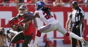 TAMPA, FLORIDA - SEPTEMBER 22: Mike Evans #13 of the Tampa Bay Buccaneers makes a catch in the end zone for a touchdown against Janoris Jenkins #20 of the New York Giants during the first quarter at Raymond James Stadium on September 22, 2019 in Tampa, Florida/