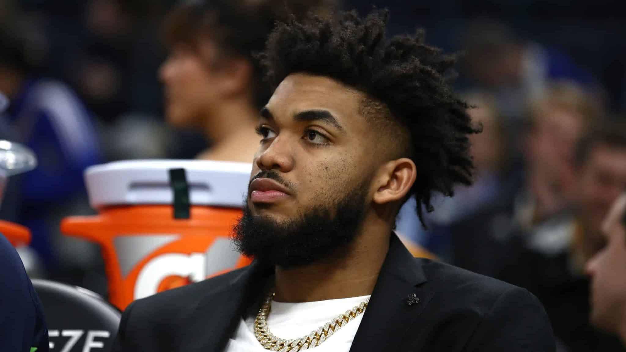 SAN FRANCISCO, CALIFORNIA - DECEMBER 23: Injured Karl-Anthony Towns #32 of the Minnesota Timberwolves watches his team play against the Golden State Warriors at Chase Center on December 23, 2019 in San Francisco, California. NOTE TO USER: User expressly acknowledges and agrees that, by downloading and/or using this photograph, user is consenting to the terms and conditions of the Getty Images License Agreement.