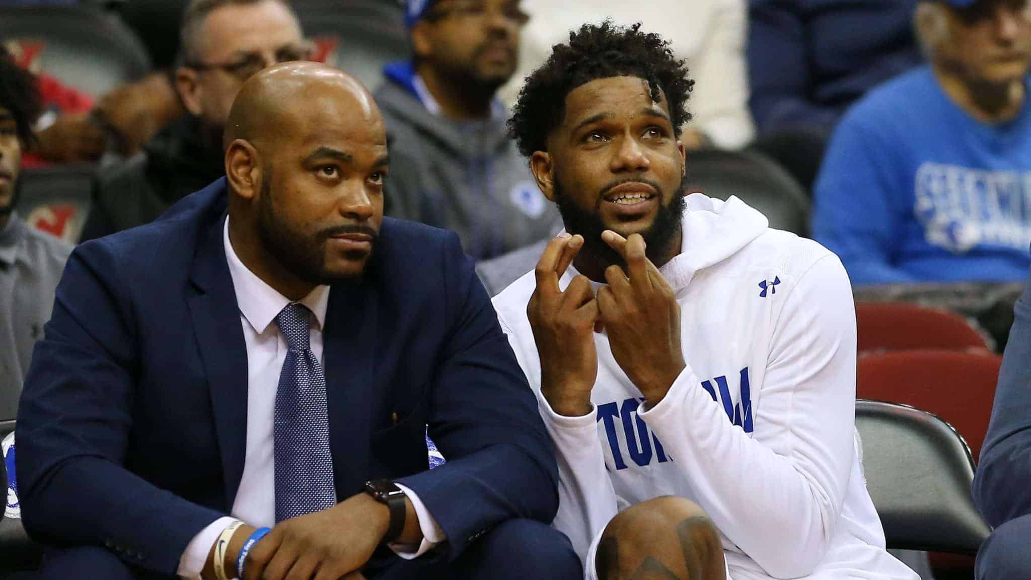 NEWARK, NJ - NOVEMBER 23: Myles Powell #13 of the Seton Hall Pirates crosses his fingers while sitting next to assistant coach Brandon Hall during the second half of a college basketball game against the Florida A&M Rattlers at Prudential Center on November 23, 2019 in Newark, New Jersey. Seton Hall defeated Florida A&M 87-51.