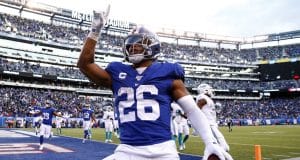 EAST RUTHERFORD, NEW JERSEY - DECEMBER 15: Saquon Barkley #26 of the New York Giants celebrates his touchdown in the fourth quarter against the Miami Dolphins at MetLife Stadium on December 15, 2019 in East Rutherford, New Jersey.The New York Giants defeated the Miami Dolphins 31-13