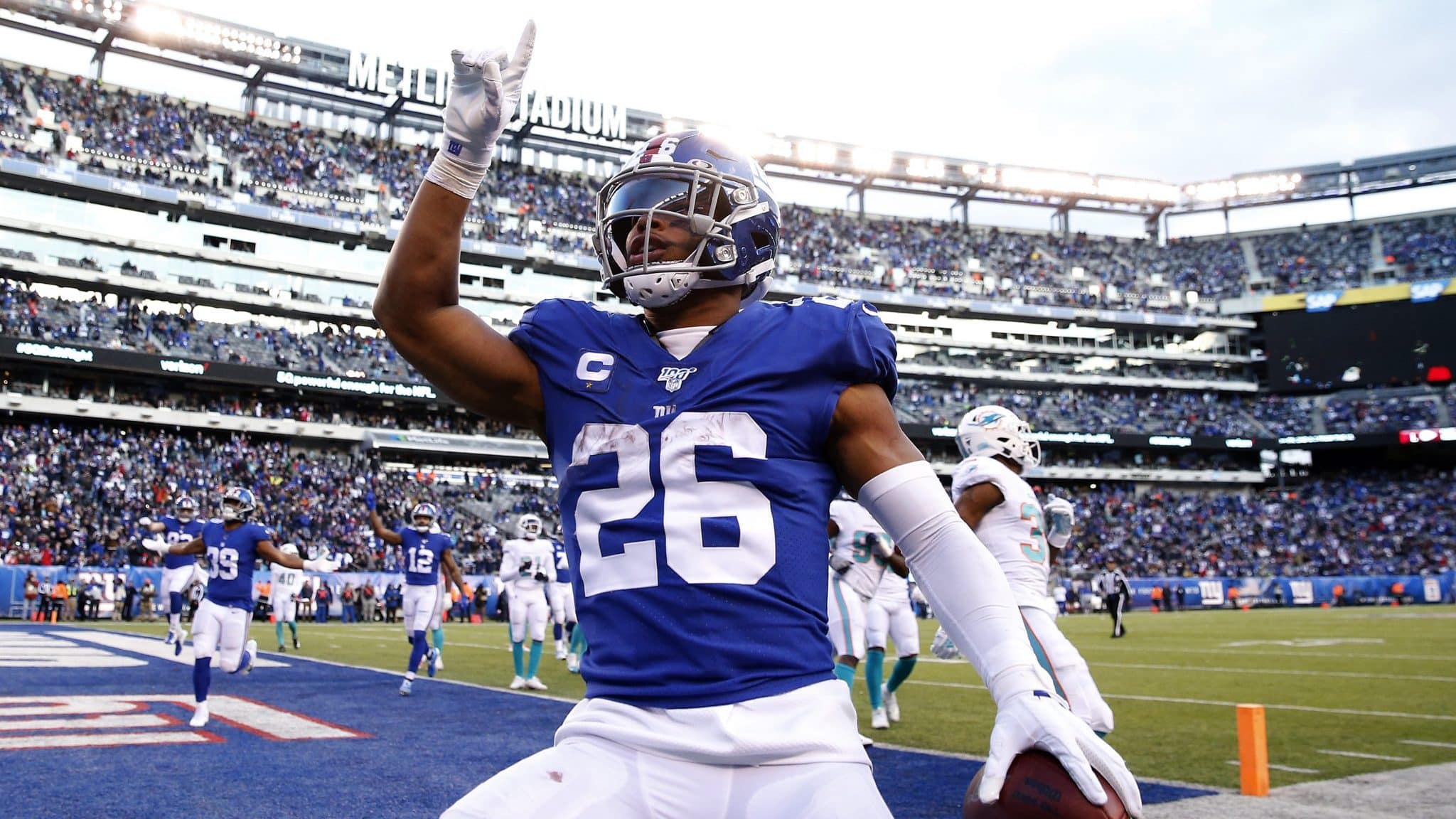 EAST RUTHERFORD, NEW JERSEY - DECEMBER 15: Saquon Barkley #26 of the New York Giants celebrates his touchdown in the fourth quarter against the Miami Dolphins at MetLife Stadium on December 15, 2019 in East Rutherford, New Jersey.The New York Giants defeated the Miami Dolphins 31-13