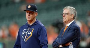 HOUSTON, TEXAS - OCTOBER 05: Manager AJ Hinch #14 talks with Jeff Luhnow, General Manager of the Houston Astros, prior to game two of the American League Division Series against the Tampa Bay Rays at Minute Maid Park on October 05, 2019 in Houston, Texas.