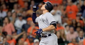 HOUSTON, TX - OCTOBER 20: Aaron Judge #99 of the New York Yankees celebrates after hitting a solo home run against Brad Peacock #41 of the Houston Astros during the eighth inning in Game Six of the American League Championship Series at Minute Maid Park on October 20, 2017 in Houston, Texas.