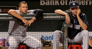 BALTIMORE, MD - SEPTEMBER 11: Alex Rodriguez #13 (L) and Derek Jeter #2 of the New York Yankees look on against the Baltimore Orioles in the ninth inning at Oriole Park at Camden Yards on September 11, 2013 in Baltimore, Maryland.