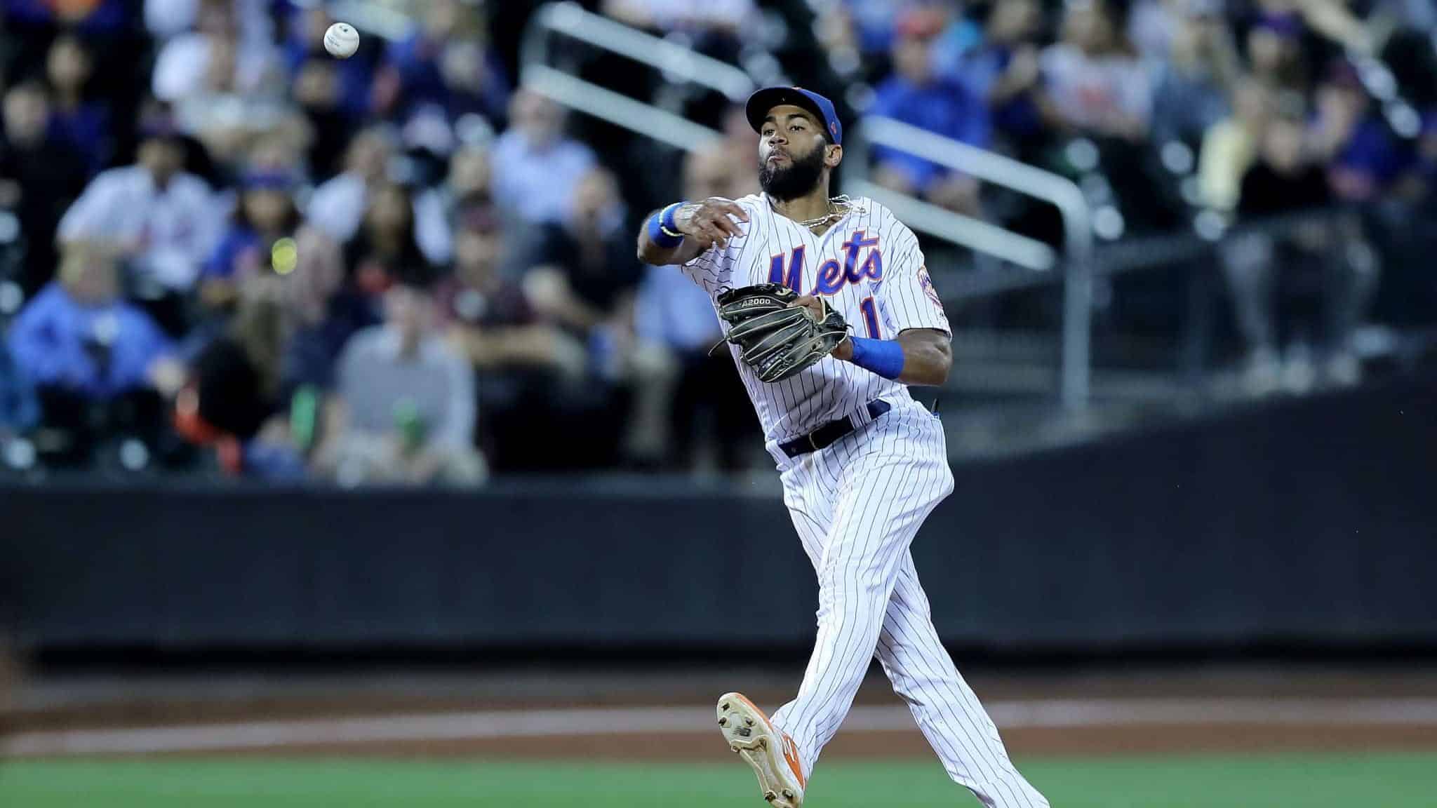 NEW YORK, NEW YORK - SEPTEMBER 24: Amed Rosario #1 of the New York Mets sends the ball to first for the out on a hit by Miguel Rojas of hte Miami Marlins in the fourth inning at Citi Field on September 24, 2019 in the Flushing neighborhood of the Queens borough of New York City.
