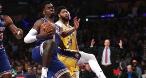 LOS ANGELES, CALIFORNIA - JANUARY 07: Bobby Portis #1 of the New York Knicks rebounds past Anthony Davis #3 of the Los Angeles Lakers during the first half of a game at Staples Center on January 07, 2020 in Los Angeles, California.