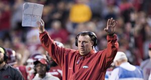 FAYETTEVILLE, AR - NOVEMBER 24: Head Coach Bret Bielema of the Arkansas Razorbacks signals to the officials during a game against the Missouri Tigers at Razorback Stadium on November 24, 2017 in Fayetteville, Arkansas. The Tigers defeated the Razorbacks 48-45.