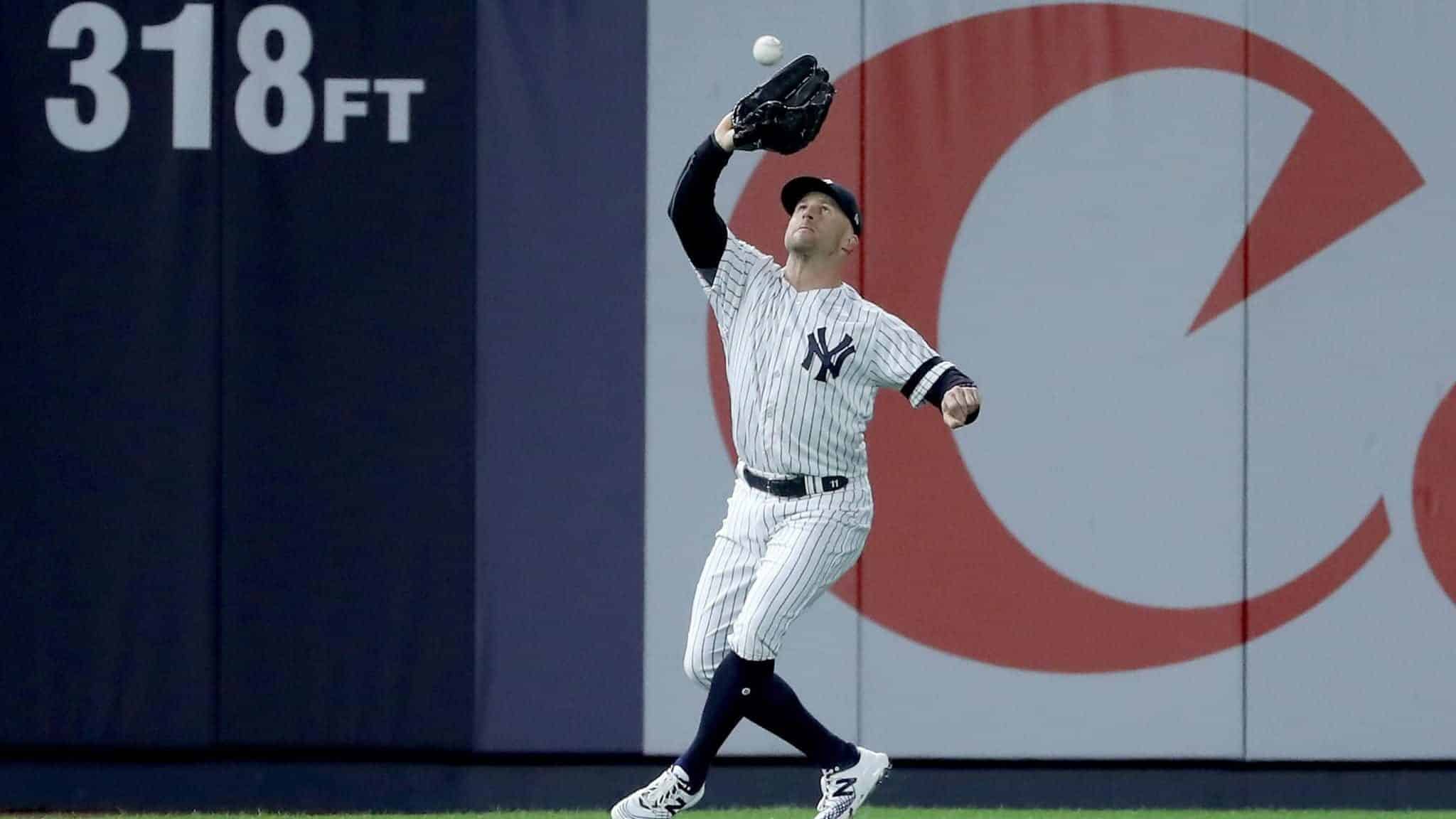 NEW YORK, NEW YORK - OCTOBER 18: Brett Gardner #11 of the New York Yankees catches a pop-up fly hit by Josh Reddick #22 of the Houston Astros during the seventh inning in game five of the American League Championship Series at Yankee Stadium on October 18, 2019 in New York City.