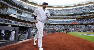 NEW YORK, NEW YORK - OCTOBER 15: CC Sabathia #52 of the New York Yankees takes the field as he is introduced prior to game three of the American League Championship Series against the Houston Astros at Yankee Stadium on October 15, 2019 in New York City.