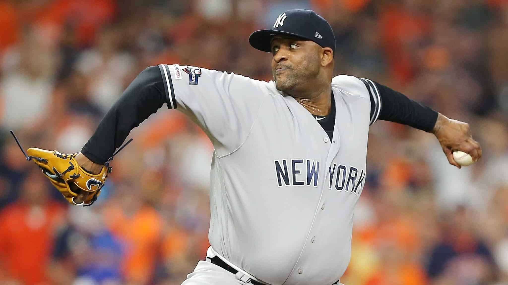HOUSTON, TEXAS - OCTOBER 13: CC Sabathia #52 of the New York Yankees pitches during the tenth inning against the Houston Astros in game two of the American League Championship Series at Minute Maid Park on October 13, 2019 in Houston, Texas.