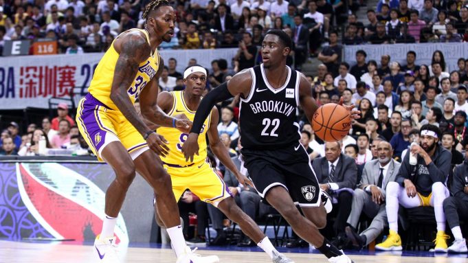 SHENZHEN, CHINA - OCTOBER 12: Caris LeVert #22 of the Brooklyn Nets in action during the match against Rajon Rondo #9 and Dwight Howard #39 of the Los Angeles Lakers during a preseason game as part of 2019 NBA Global Games China at Shenzhen Universiade Center on October 12, 2019 in Shenzhen, Guangdong, China.
