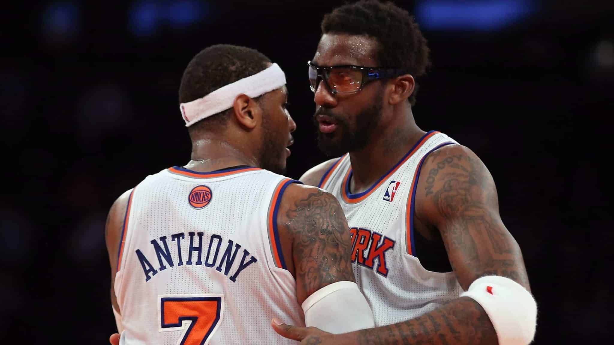 NEW YORK, NY - DECEMBER 11: Amar'e Stoudemire #1 and Carmelo Anthony #7 of the New York Knicks embrance following their victory over the Chicago Bulls at Madison Square Garden on December 11, 2013 in New York City. The Knicks defeated the Bulls 83-78.
