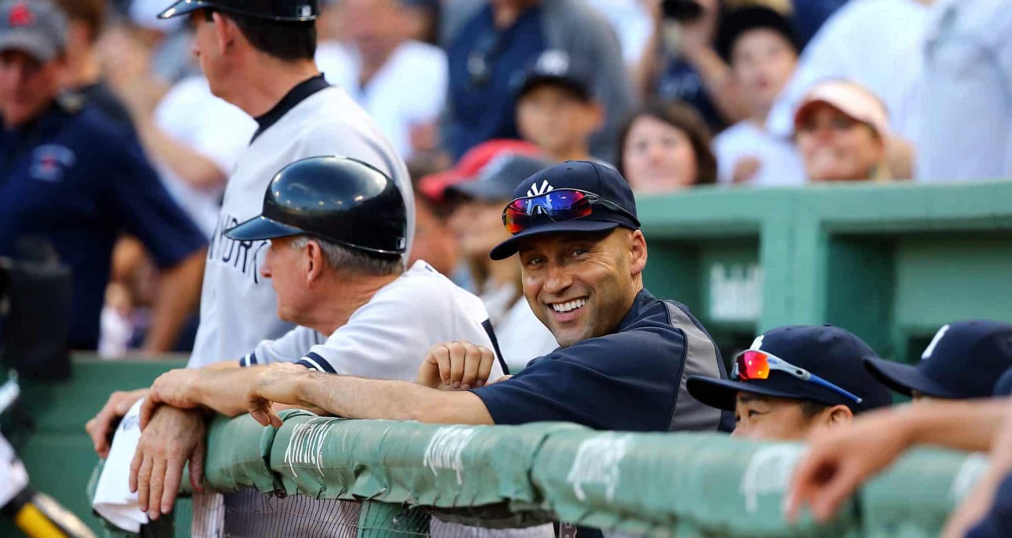 BOSTON, MA - SEPTEMBER 28: Derek Jeter #2 of the New York Yankees looks on from the dugout against the Boston Red Sox during the last game of the season at Fenway Park on September 28, 2014 in Boston, Massachusetts.
