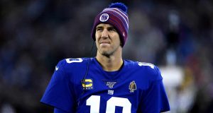 EAST RUTHERFORD, NEW JERSEY - DECEMBER 29: Eli Manning #10 of the New York Giants looks on from the sidelines against the Philadelphia Eagles during the first quarter in the game at MetLife Stadium on December 29, 2019 in East Rutherford, New Jersey.