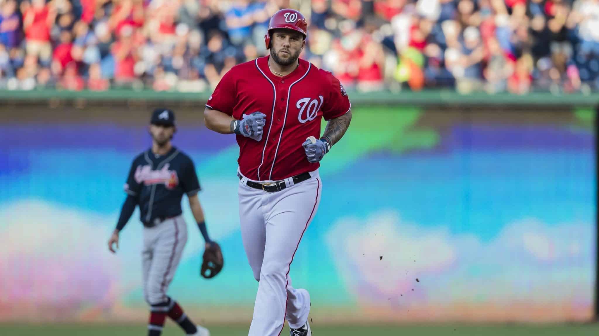 WASHINGTON, DC - JUNE 22: Matt Adams #15 of the Washington Nationals rounds the bases after hitting a two-run home run against the Atlanta Braves during the first inning at Nationals Park on June 22, 2019 in Washington, DC.