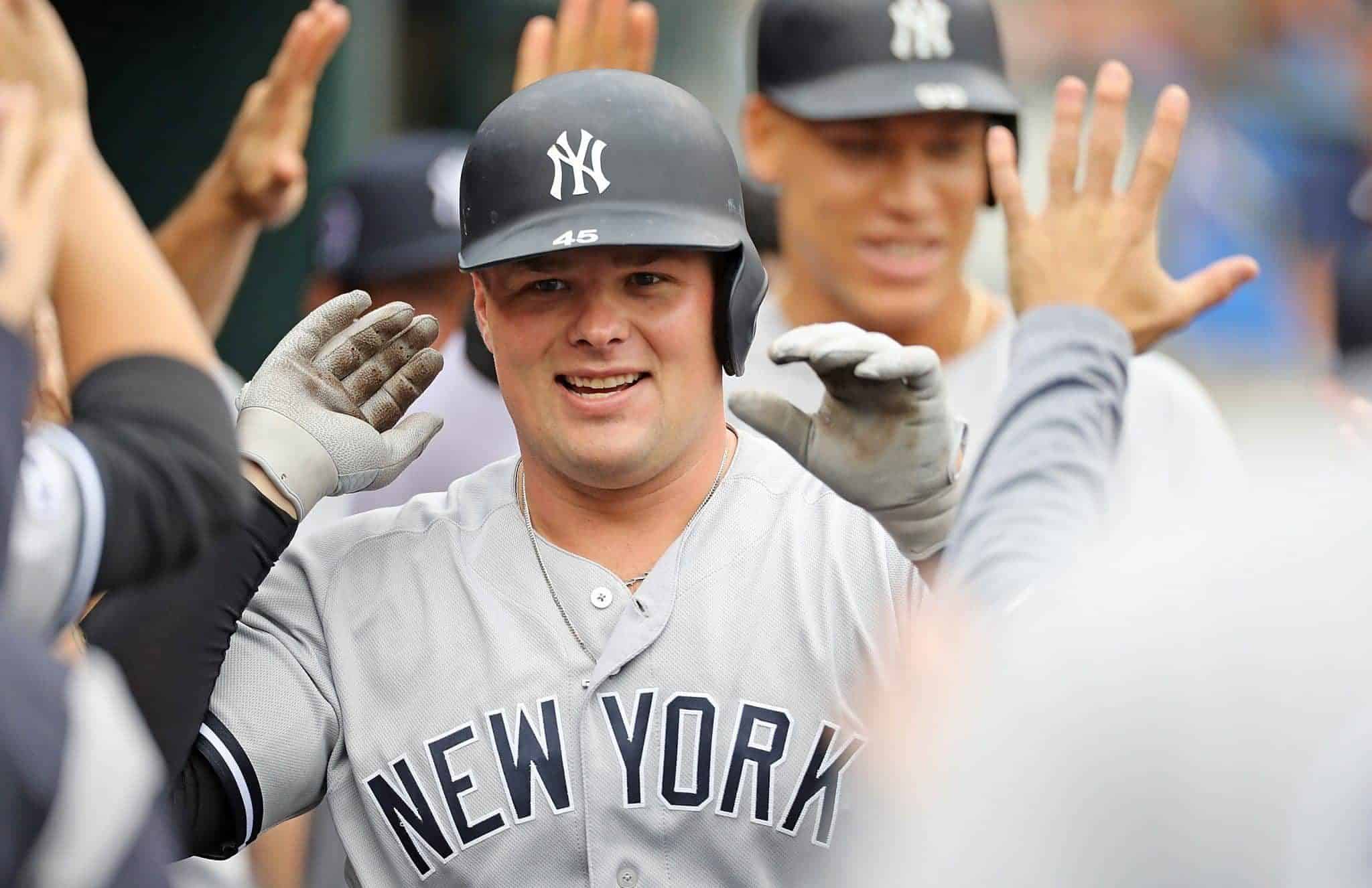 DETROIT, MI - SEPTEMBER 12: Luke Voit #45 of the New York Yankees celebrates in the dugout after hitting a first-inning, two-run home run during game one of a double header against the Detroit Tigers at Comerica Park on September 12, 2019 in Detroit, Michigan.