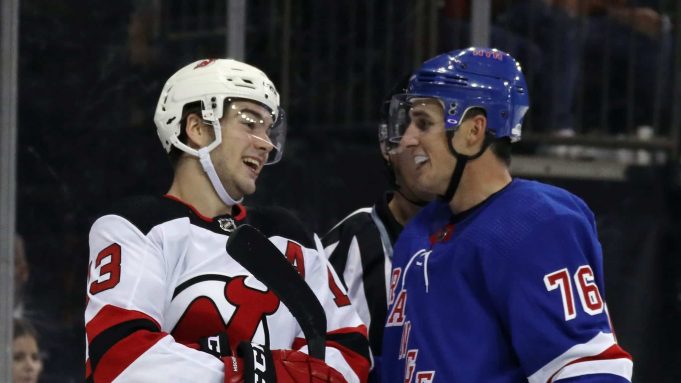 NEW YORK, NEW YORK - SEPTEMBER 18: Nico Hischier #13 of the New Jersey Devils nd Brady Skjei #76 of the New York Rangers exchange a laugh during the third period at Madison Square Garden on September 18, 2019 in New York City. The Devils defeated the Rangers 4-3.