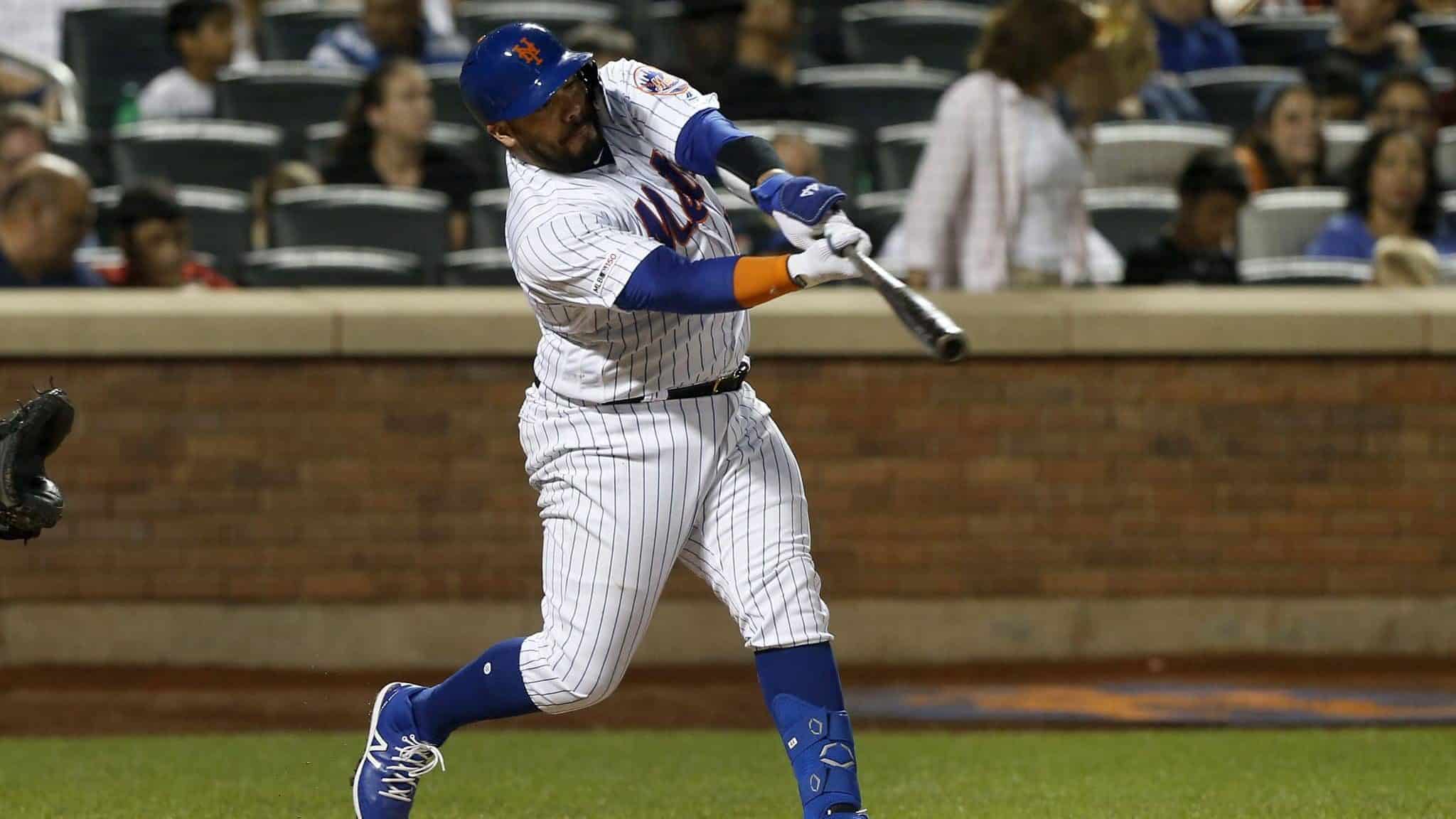 NEW YORK, NEW YORK - SEPTEMBER 28: Rene Rivera #44 of the New York Mets connects on a third inning two run home run against the Atlanta Braves at Citi Field on September 28, 2019 in New York City.