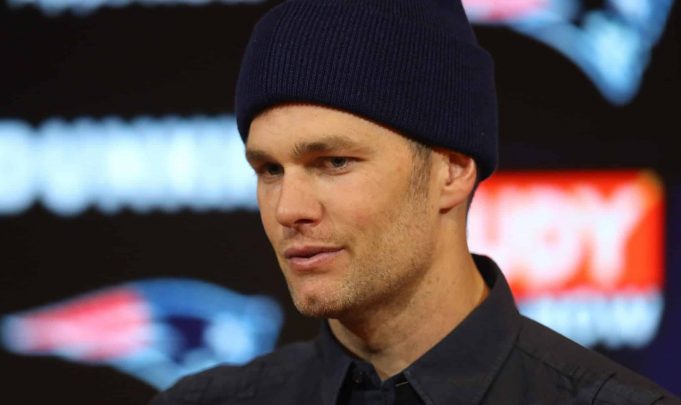 FOXBOROUGH, MASSACHUSETTS - JANUARY 04: Tom Brady #12 of the New England Patriots talks with the media during a press conference after the AFC Wild Card Playoff game against the Tennessee Titans at Gillette Stadium on January 04, 2020 in Foxborough, Massachusetts.