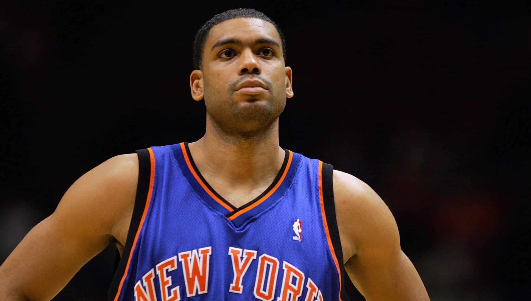 EAST RUTHERFORD, NJ - DECEMBER 14: Allan Houston #20 of the New York Knicks looks on during a game against the New Jersey Nets on December 14, 2004 at Continental Airlines Arena in East Rutherford, New Jersey. The Knicks won 87-79. NOTE TO USER: User expressly acknowledges and agrees that, by downloading and/or using this Photograph, User is consenting to the terms and conditions of the Getty Images License Agreement.