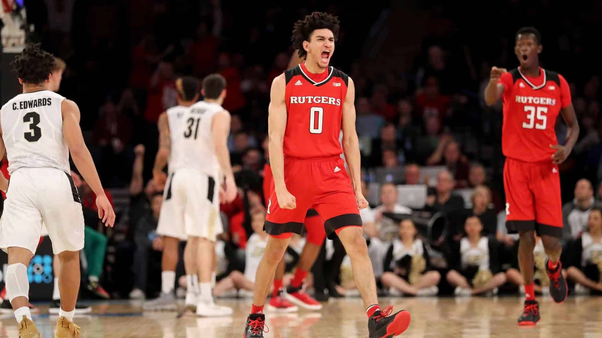 NEW YORK, NY - MARCH 02: Geo Baker #0 of the Rutgers Scarlet Knights reacts in the first half against the Purdue Boilermakers during quarterfinals of the Big Ten Basketball Tournament at Madison Square Garden on March 2, 2018 in New York City.