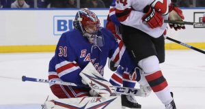 NEW YORK, NEW YORK - SEPTEMBER 18: Igor Shesterkin #31 of the New York Rangers defends the net against Brandon Baddock #34 of the New Jersey Devils during the third period at Madison Square Garden on September 18, 2019 in New York City. The Devils defeated the Rangers 4-3.