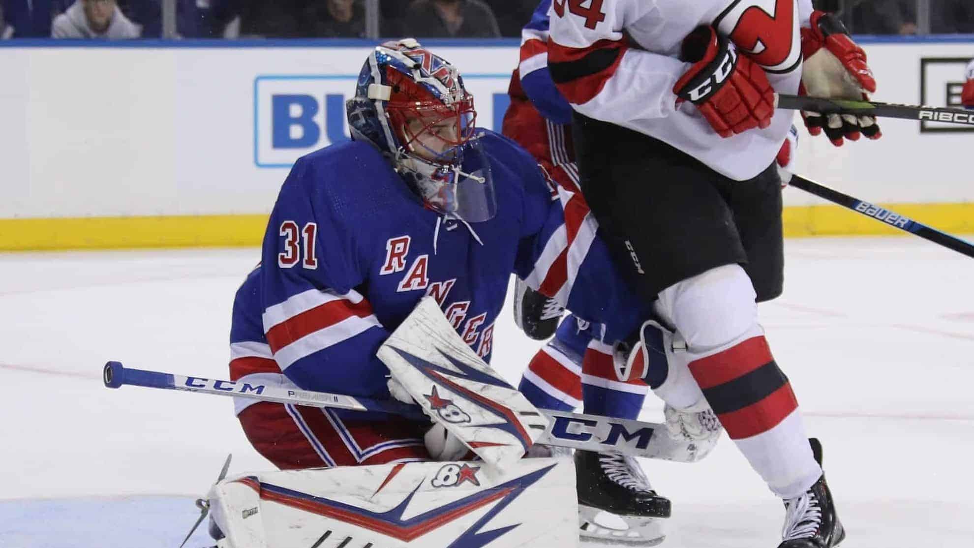NEW YORK, NEW YORK - SEPTEMBER 18: Igor Shesterkin #31 of the New York Rangers defends the net against Brandon Baddock #34 of the New Jersey Devils during the third period at Madison Square Garden on September 18, 2019 in New York City. The Devils defeated the Rangers 4-3.