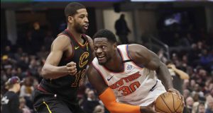 New York Knicks' Julius Randle (30) drives past Cleveland Cavaliers' Tristan Thompson (13) in the second half of an NBA basketball game, Monday, Jan. 20, 2020, in Cleveland. New York won 106-86.