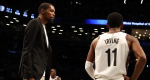 NEW YORK, NEW YORK - JANUARY 18: Kevin Durant #7 of the Brooklyn Nets talks to Kyrie Irving #11 of the Brooklyn Nets during their game against the Milwaukee Bucksat Barclays Center on January 18, 2020 in New York City. NOTE TO USER: User expressly acknowledges and agrees that, by downloading and/or using this photograph, user is consenting to the terms and conditions of the Getty Images License Agreement.
