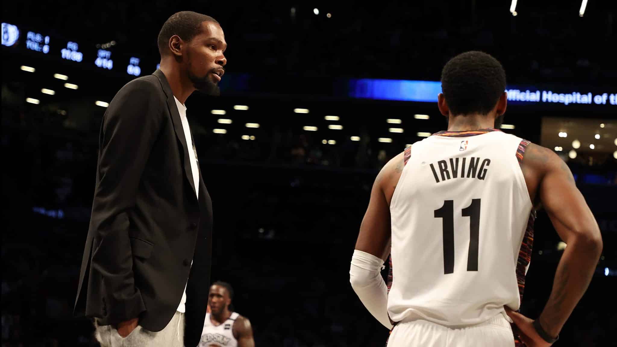 NEW YORK, NEW YORK - JANUARY 18: Kevin Durant #7 of the Brooklyn Nets talks to Kyrie Irving #11 of the Brooklyn Nets during their game against the Milwaukee Bucksat Barclays Center on January 18, 2020 in New York City. NOTE TO USER: User expressly acknowledges and agrees that, by downloading and/or using this photograph, user is consenting to the terms and conditions of the Getty Images License Agreement.