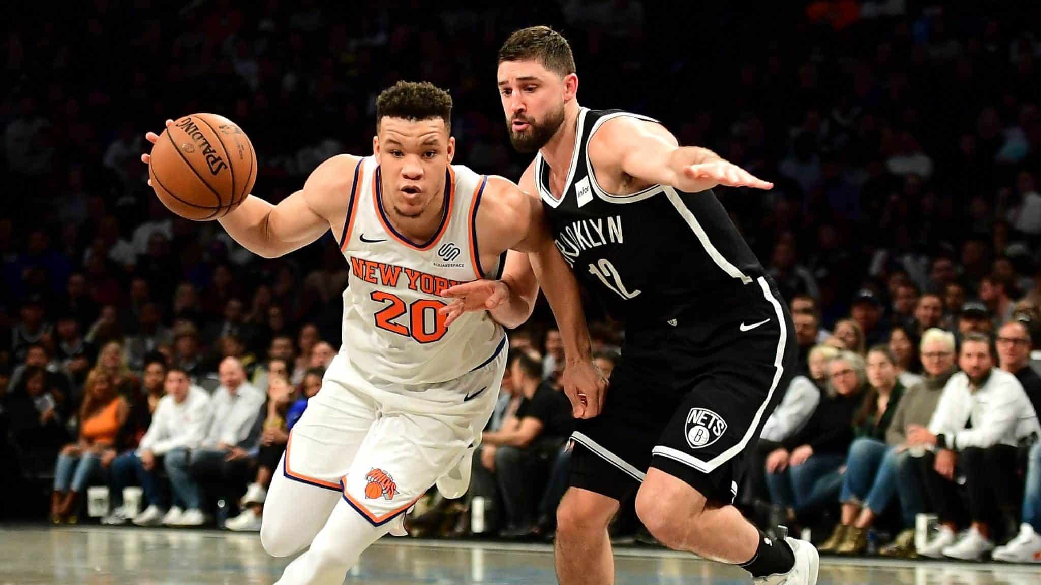 NEW YORK, NEW YORK - OCTOBER 25: Joe Harris #12 of the Brooklyn Nets guards Kevin Knox II #20 of the New York Knicks as he dribbles the ball during the second half of their game at Barclays Center on October 25, 2019 in the Brooklyn borough of New York City. NOTE TO USER: User expressly acknowledges and agrees that, by downloading and or using this photograph, User is consenting to the terms and conditions of the Getty Images License Agreement.