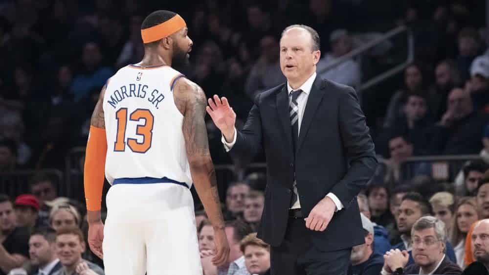 New York Knicks head coach Mike Miller, right, talks to forward Marcus Morris Sr. (13) in the first half of an NBA basketball game against the Philadelphia 76ers, Saturday, Jan. 18, 2020, at Madison Square Garden in New York.