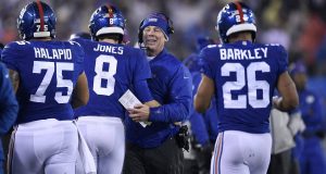 EAST RUTHERFORD, NEW JERSEY - DECEMBER 29: Head coach Pat Shurmur of the New York Giants celebrates with Daniel Jones #8 and Saquon Barkley #26 after a touchdown during the third quarter in the game at MetLife Stadium on December 29, 2019 in East Rutherford, New Jersey.