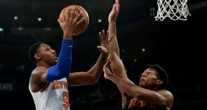 NEW YORK, NEW YORK - DECEMBER 17: RJ Barrett #9 of the New York Knicks drives toward the basket past De'Andre Hunter #12 of the Atlanta Hawks during the second half of their game at Madison Square Garden on December 17, 2019 in New York City.