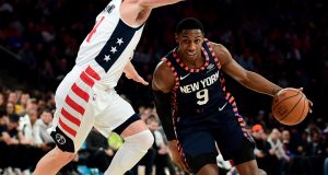 NEW YORK, NEW YORK - DECEMBER 23: RJ Barrett #9 of the New York Knicks drives past Garrison Mathews #24 of the Washington Wizards during the second half of their game at Madison Square Garden on December 23, 2019 in New York City. NOTE TO USER: User expressly acknowledges and agrees that, by downloading and or using this photograph, User is consenting to the terms and conditions of the Getty Images License Agreement.