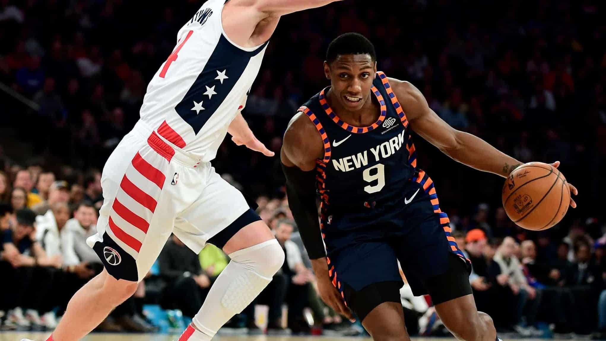 NEW YORK, NEW YORK - DECEMBER 23: RJ Barrett #9 of the New York Knicks drives past Garrison Mathews #24 of the Washington Wizards during the second half of their game at Madison Square Garden on December 23, 2019 in New York City. NOTE TO USER: User expressly acknowledges and agrees that, by downloading and or using this photograph, User is consenting to the terms and conditions of the Getty Images License Agreement.
