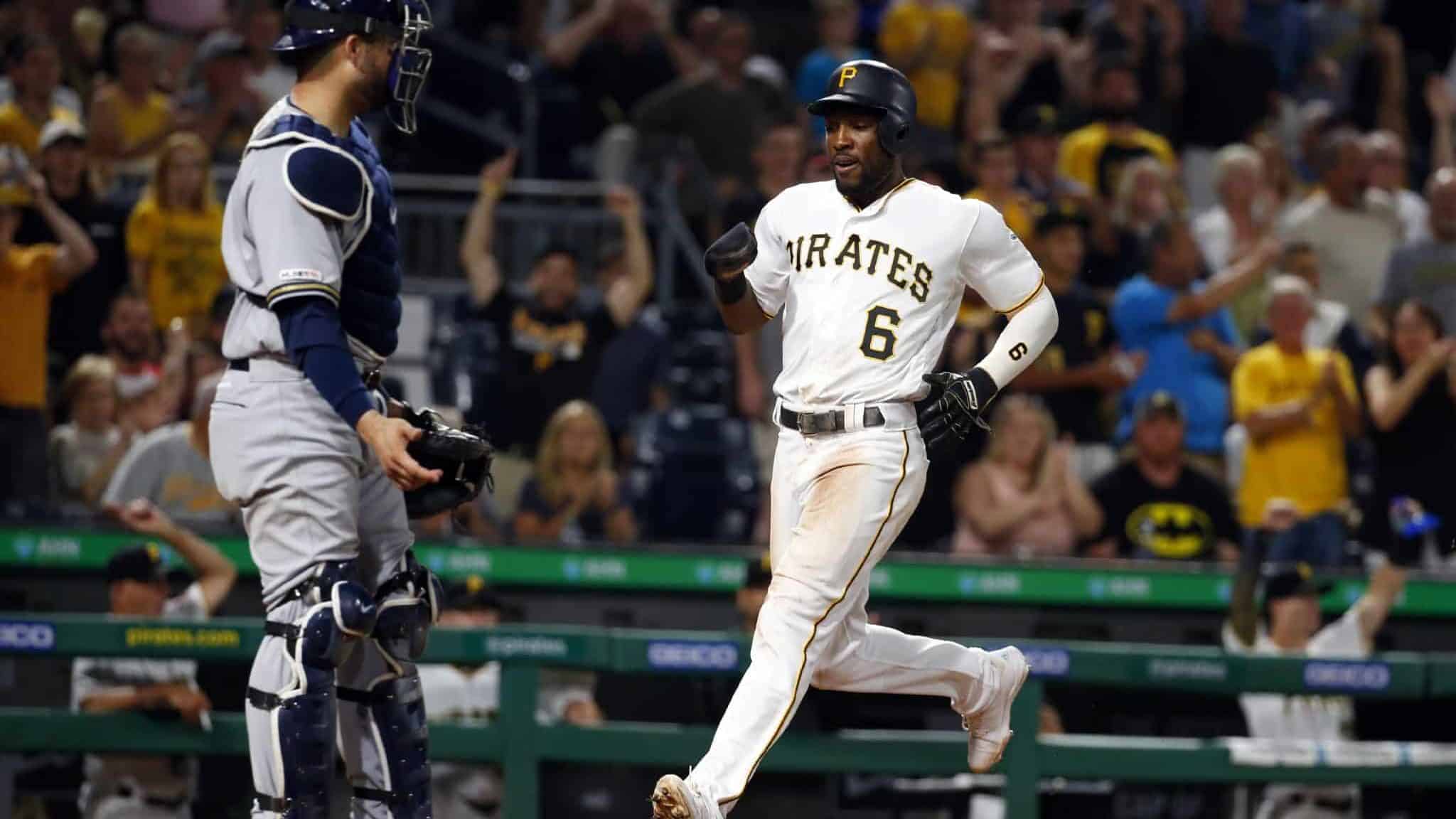 PITTSBURGH, PA - AUGUST 06: Starling Marte #6 of the Pittsburgh Pirates scores on an RBI double in the sixth inning against the Milwaukee Brewers at PNC Park on August 6, 2019 in Pittsburgh, Pennsylvania.