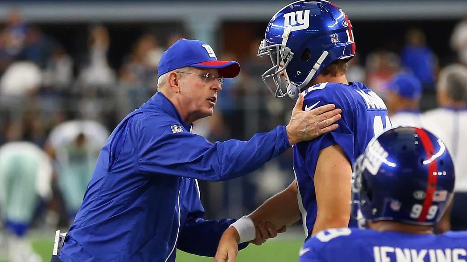 ARLINGTON, TX - SEPTEMBER 13: (L-R) Head coach Tom Coughlin of the New York Giants greets Eli Manning #10 before a game against the Dallas Cowboys at AT&T Stadium on September 13, 2015 in Arlington, Texas.