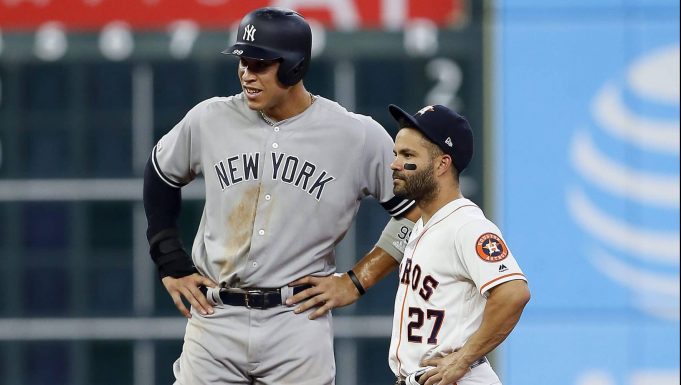 HOUSTON, TEXAS - APRIL 08: Aaron Judge #99 of the New York Yankees and Jose Altuve #27 of the Houston Astros during a break in play in the seventh inning at Minute Maid Park on April 08, 2019 in Houston, Texas.