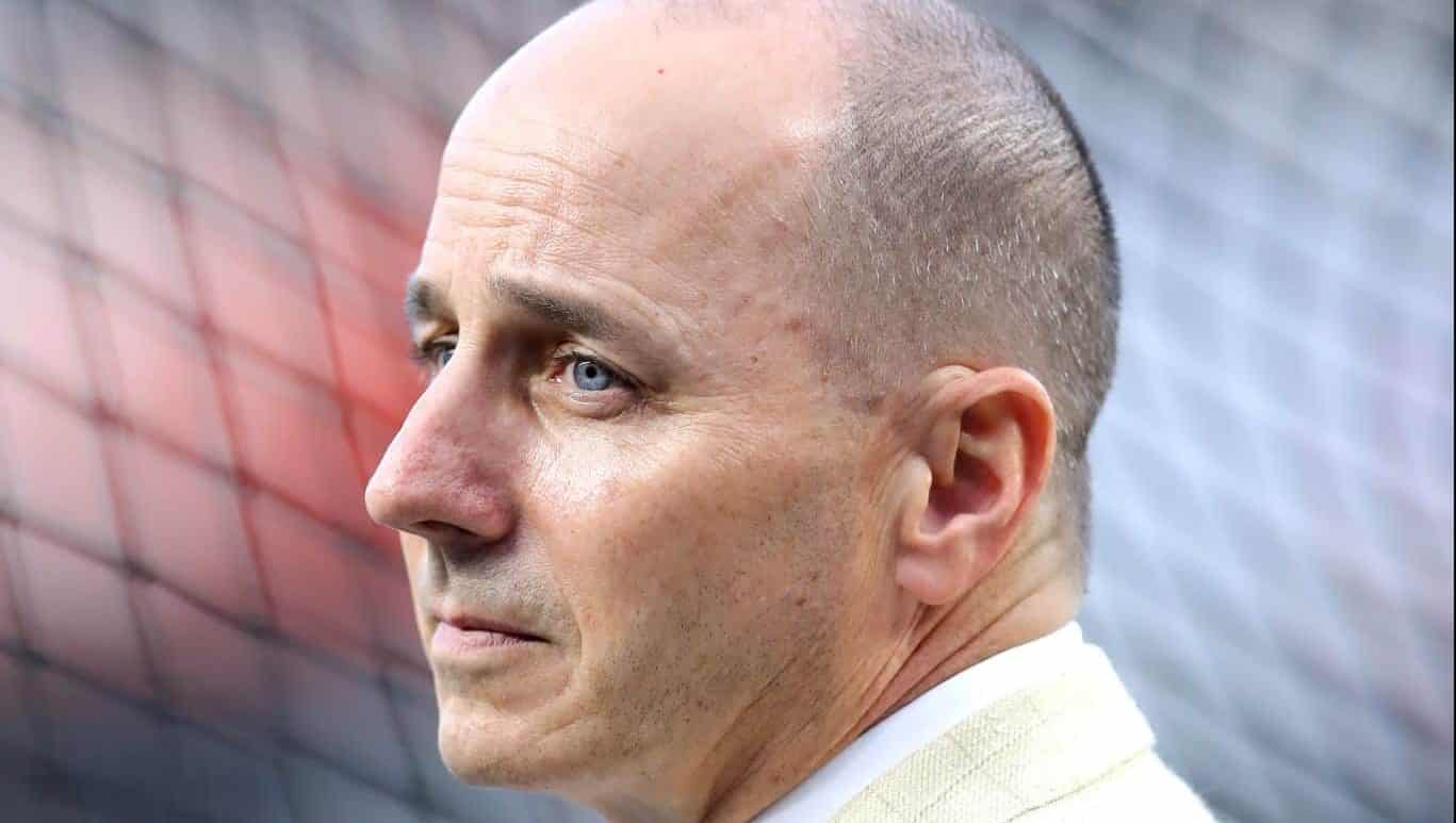 NEW YORK, NEW YORK - OCTOBER 03: : General Manager of the New York Yankees Brian Cashman looks on prior to the American League Wild Card Game between the Oakland Athletics and the New York Yankees at Yankee Stadium on October 03, 2018 in the Bronx borough of New York City.