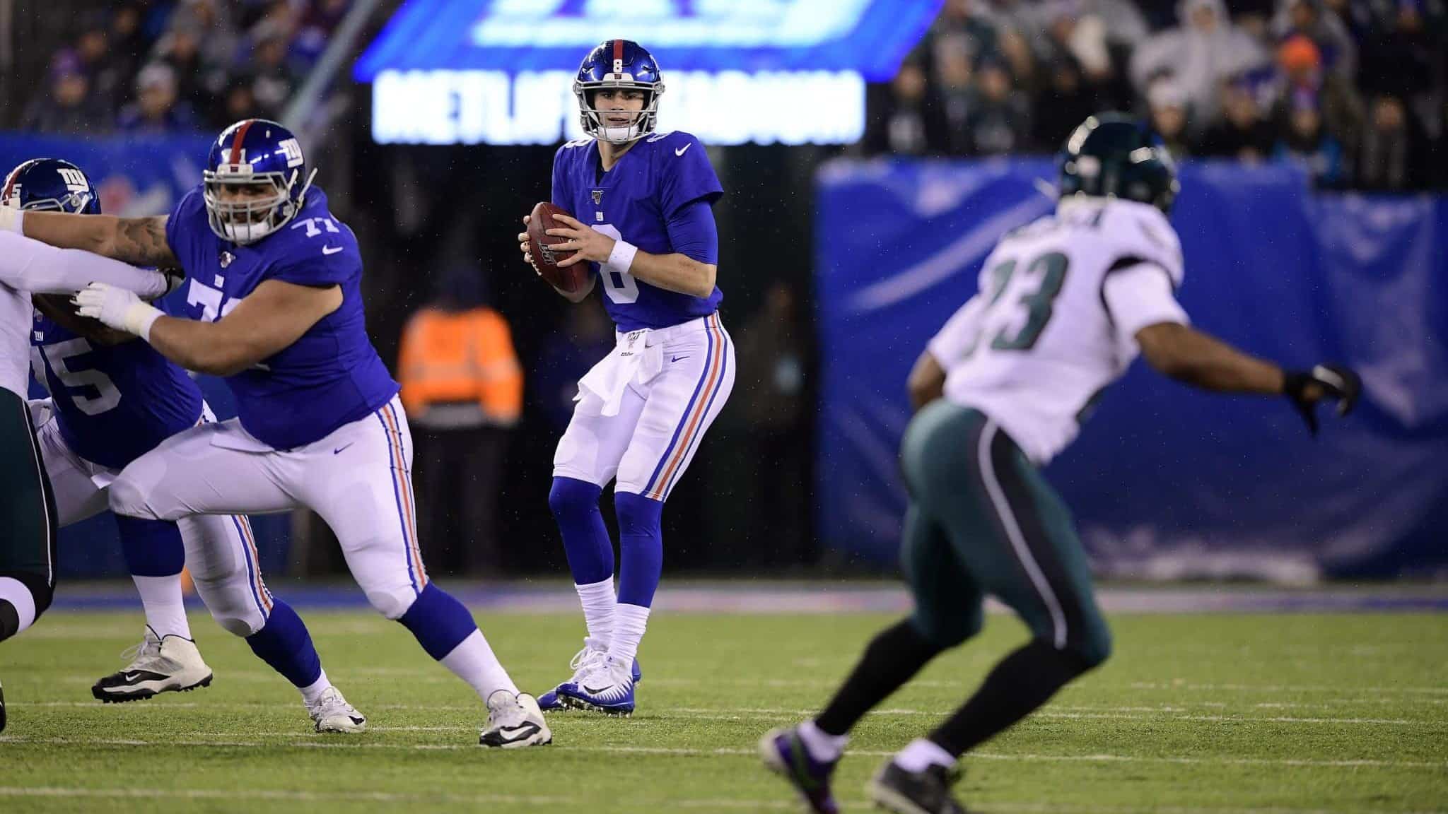 EAST RUTHERFORD, NEW JERSEY - DECEMBER 29: Daniel Jones #8 of the New York Giants looks to throw a pass against the Philadelphia Eagles during the first quarter in the game at MetLife Stadium on December 29, 2019 in East Rutherford, New Jersey.