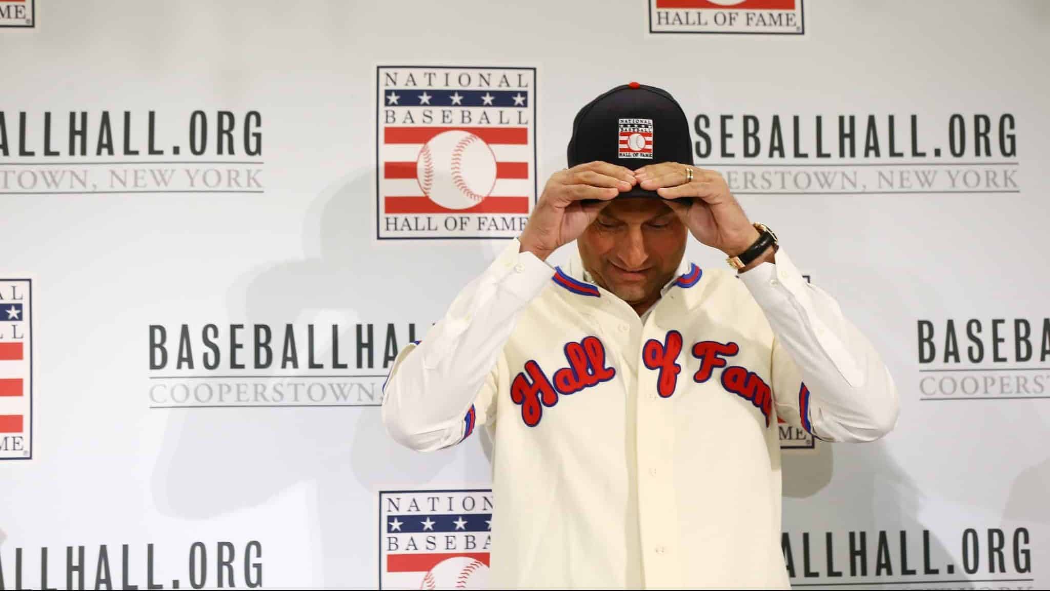 NEW YORK, NEW YORK - JANUARY 22: Derek Jeter puts on his Hall of Fame hat after being elected into the National Baseball Hall of Fame Class of 2020 on January 22, 2020 at the St. Regis Hotel in New York City. The National Baseball Hall of Fame induction ceremony will be held on Sunday, July 26, 2020 in Cooperstown, NY.