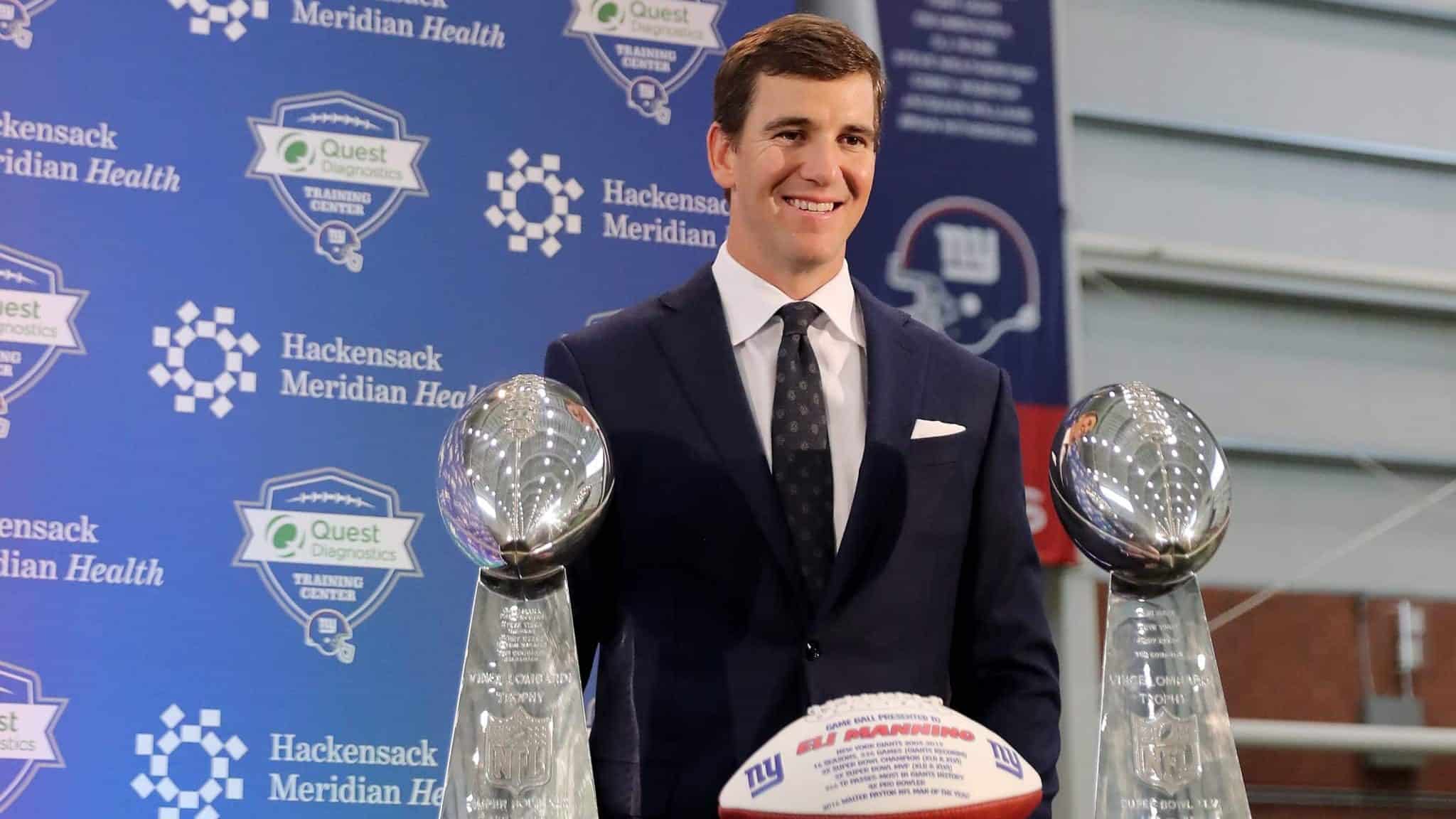 EAST RUTHERFORD, NEW JERSEY - JANUARY 24: Eli Manning of the New York Giants poses with the Vince Lombardi Trophies after a press conference to announce his retirement on January 24, 2020 at Quest Diagnostic Training Center in East Rutherford, New Jersey.The two time Super Bowl MVP is retiring after 16 seasons with the team.