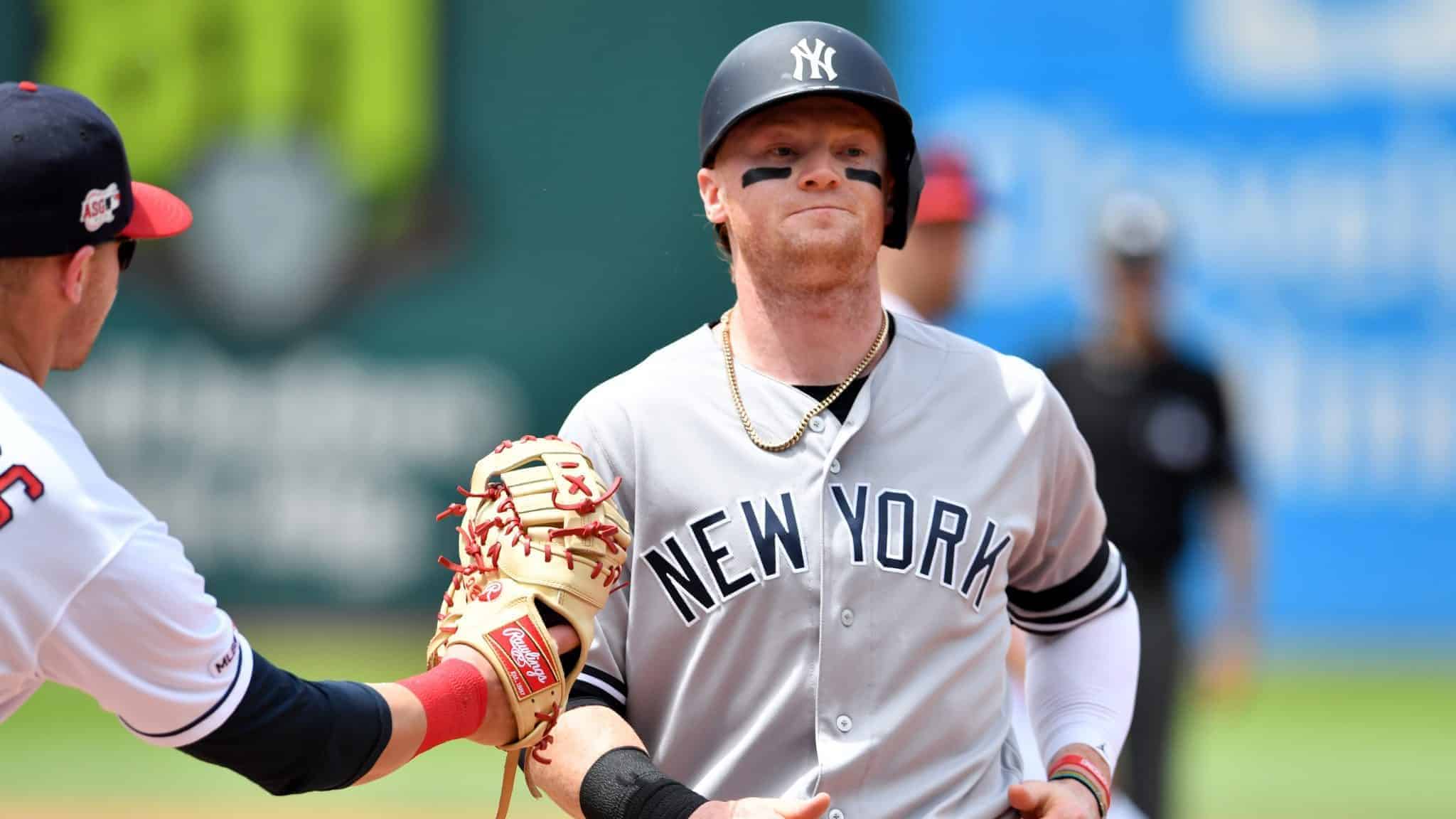 CLEVELAND, OHIO - JUNE 09: First baseman Jake Bauers #10 of the Cleveland Indians catches Clint Frazier #77 of the New York Yankees in a run down during the third inning at Progressive Field on June 09, 2019 in Cleveland, Ohio.